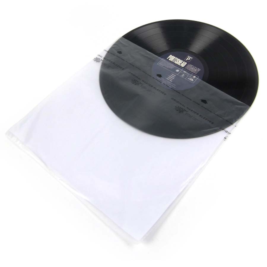 A picture of a black vinyl record slipping into a clear inner record sleeve.