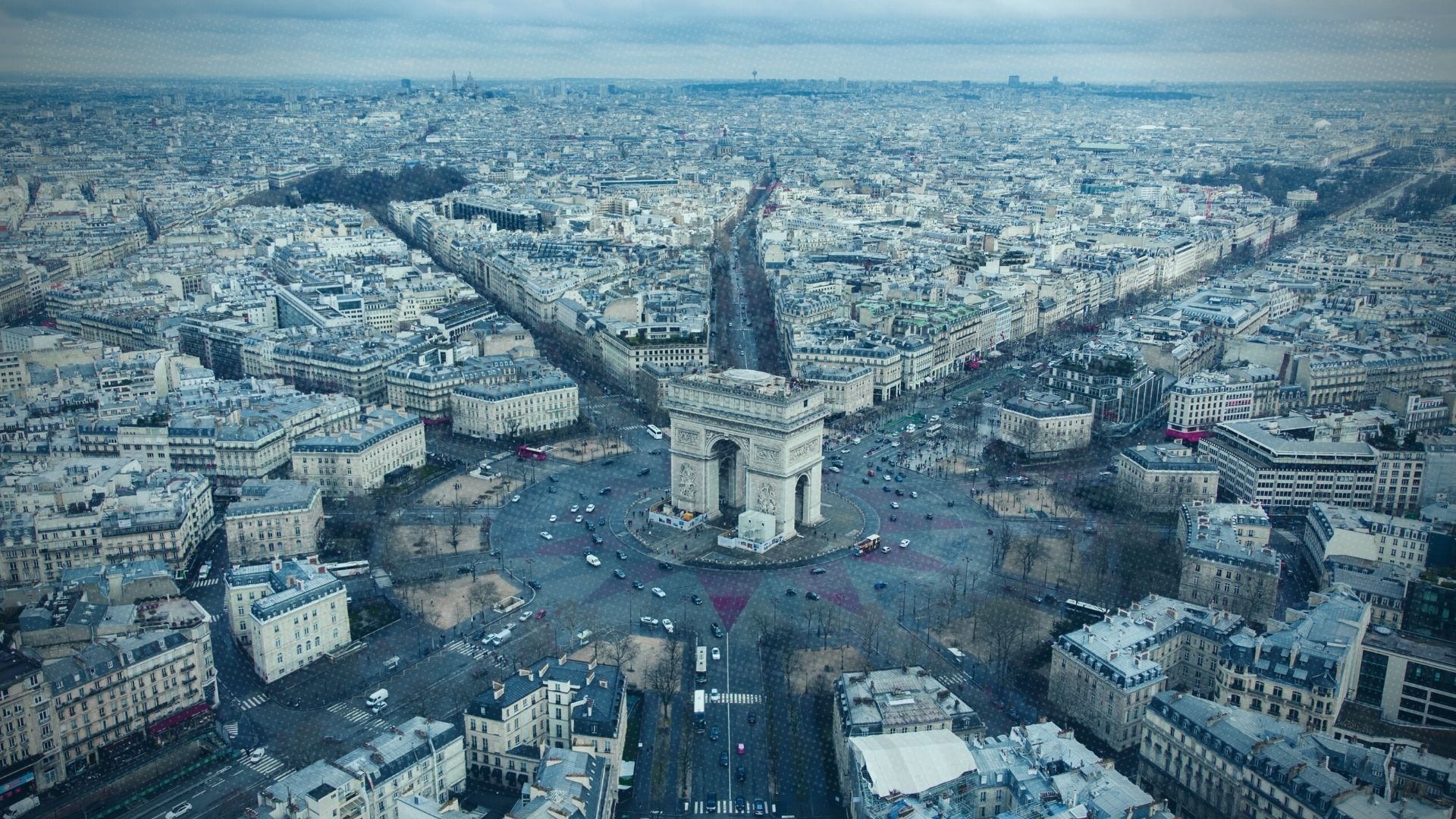 view of the arc de triomphe and paris city skyline