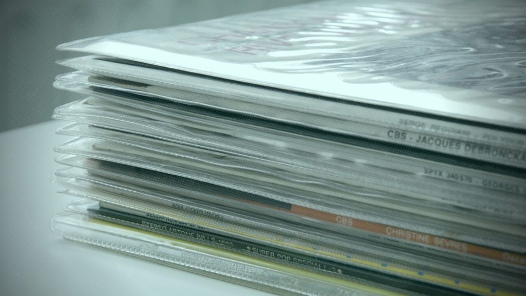 A stack of vinyl record sleeves