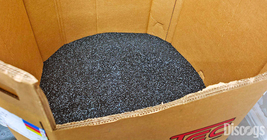 Black Vinyl Pellets in a large cardboard box