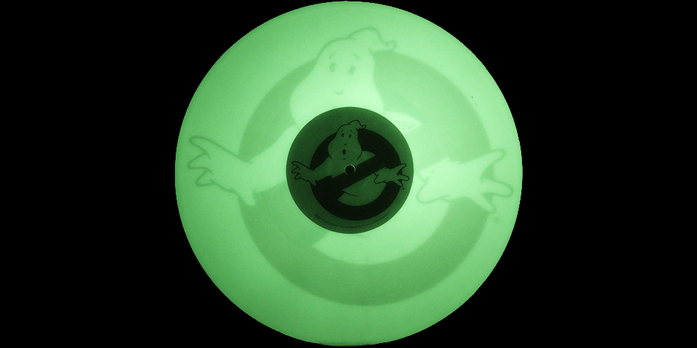 photo of a Glow in the dark Record with ghostbusters logo on the label and in the vinyl itself